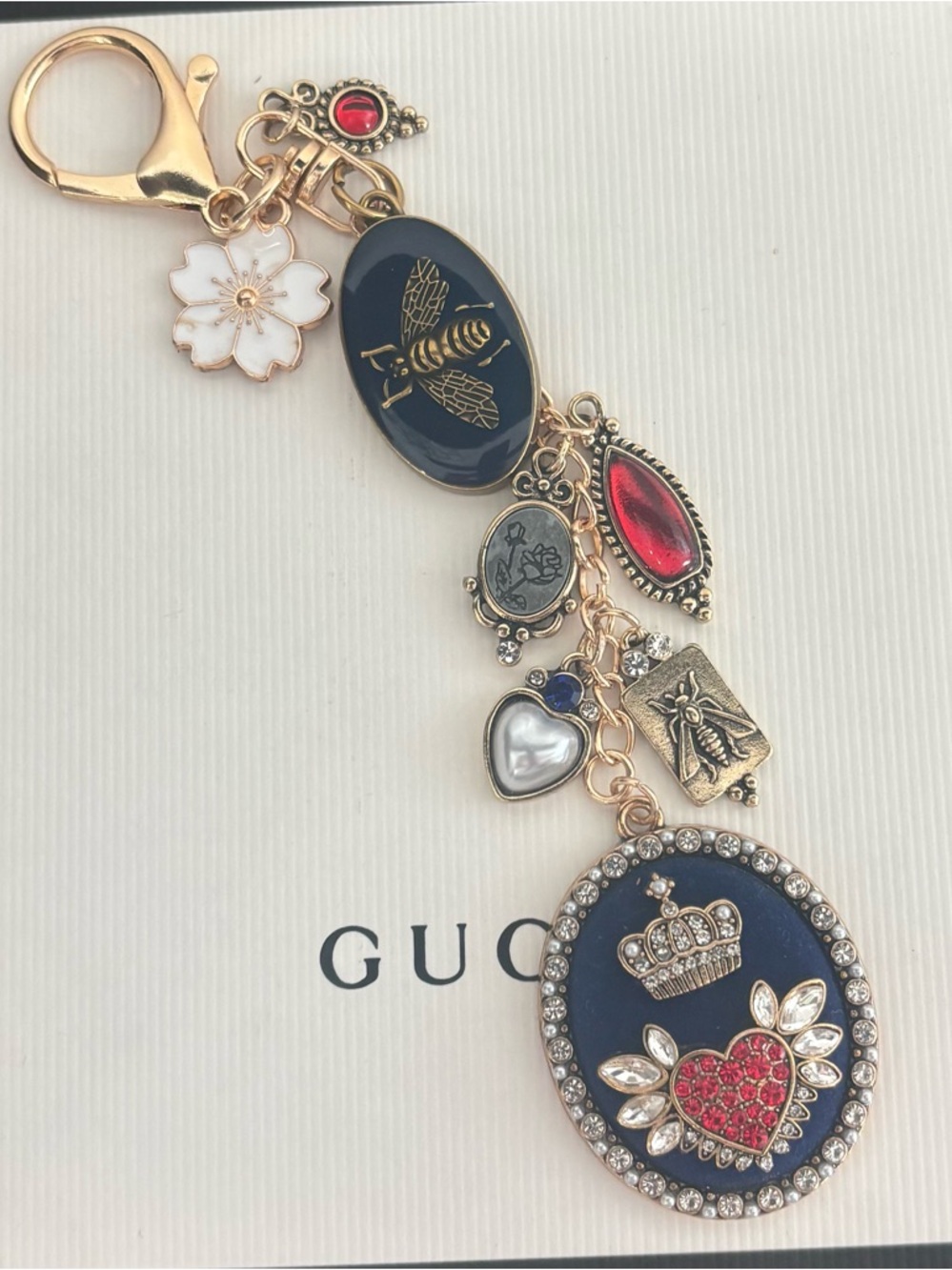 Gucci APIS Bee Medallion
Navy Bag Charm, Enamel flower, Navy Crown heart pendant